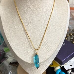 Elegant Gold Necklace with Blue Pendant